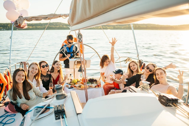 A group of girls on a Catamaran on the Vistula River in Warsaw have fun at a bachelorette party